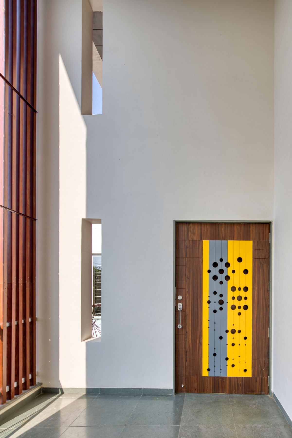 Clay roof tiles façade to minimize heat gain and has decorative function, at Vadodara, by Manoj Patel Design Studio 31