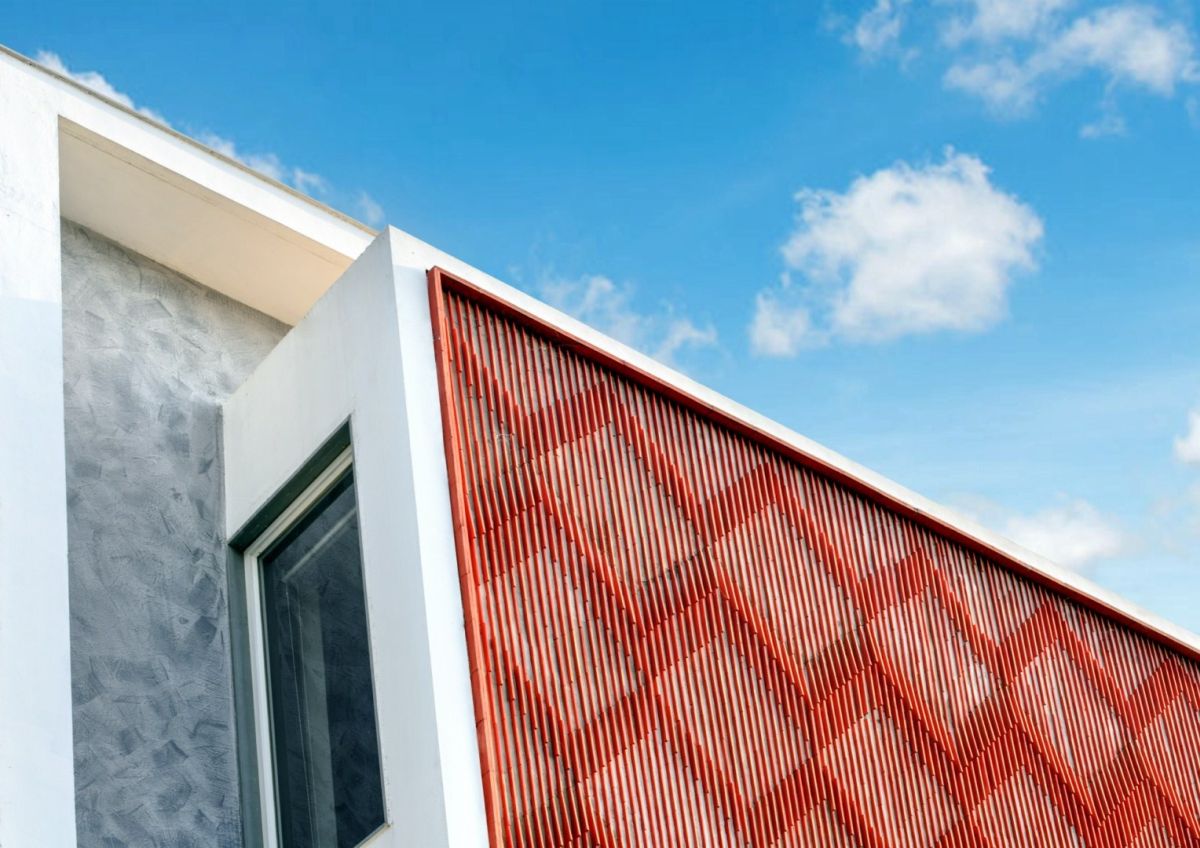 Clay roof tiles façade to minimize heat gain and has decorative function, at Vadodara, by Manoj Patel Design Studio 87