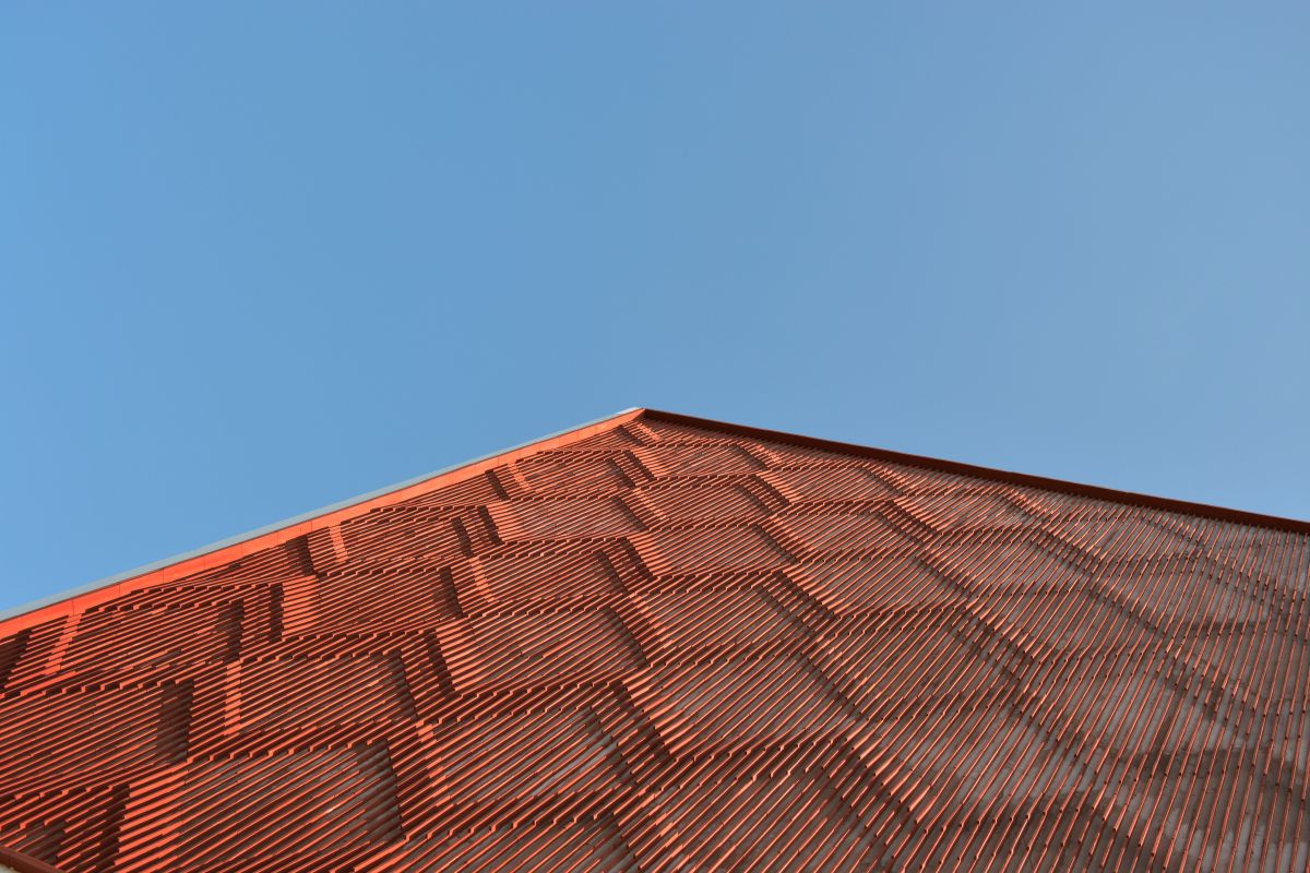 Clay roof tiles façade to minimize heat gain and has decorative function, at Vadodara, by Manoj Patel Design Studio 79