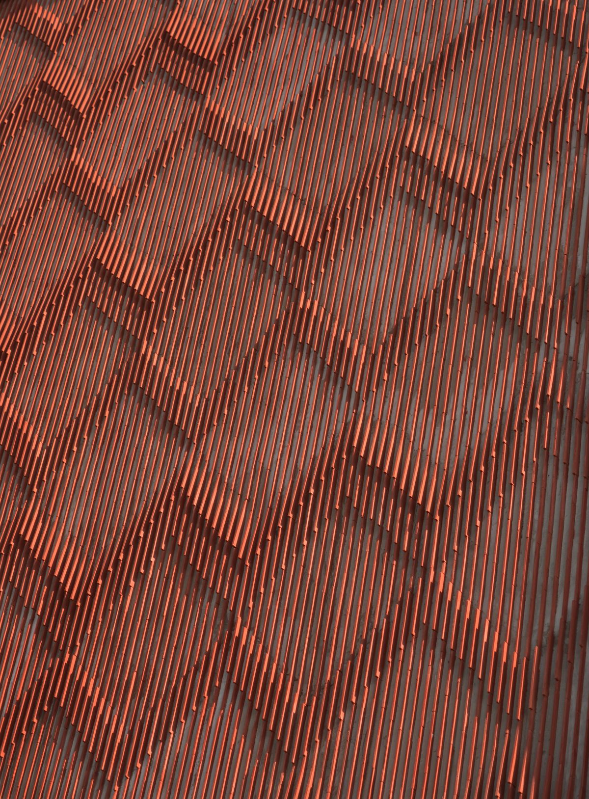 Clay roof tiles façade to minimize heat gain and has decorative function, at Vadodara, by Manoj Patel Design Studio 85