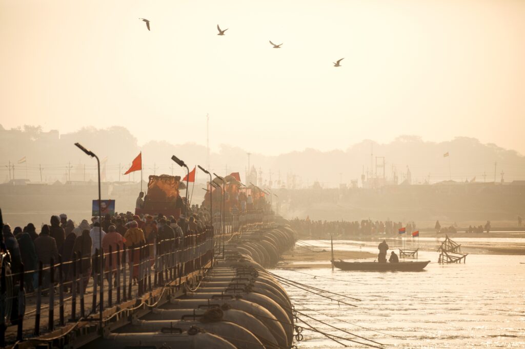 These temporary foot and car bridges join the two sides of the river Ganga. They are brought to the Kumbh from all over the region, with additional pontoons fabricated as necessary close to the site.