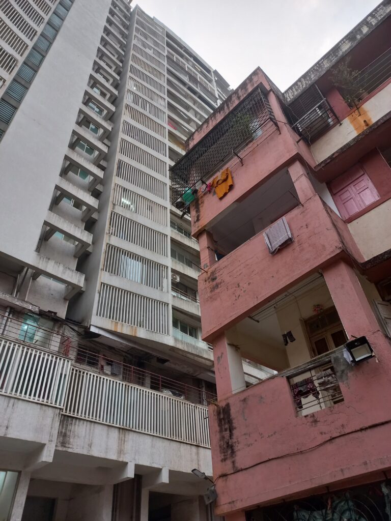 Figure 3: The change in the street connection of housing on the same street. The old housing block motivated the eyes on the street concept and an engagement with the ground while the new modern development has a multi-level podium which breaks the street connection completely. Image credits - Author