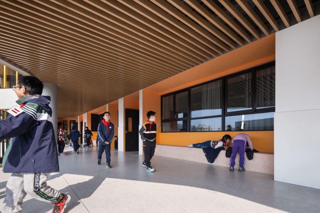 Students in the corridor of Chonggu Experimental School, Qingpu, by BAU (Brearley Architects + Urbanists). Photograph clicked by INNSImages