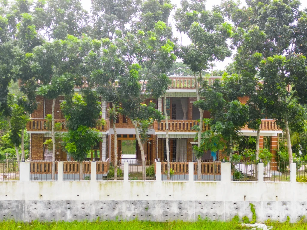 Exterior, Hawladar Bari, Shibchar, Bangladesh, by Maruf Raihan.Works. Photograph by Maruf Raihan