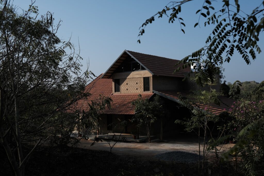 Exterior. Boulder House, Shoolagiri, Tamil Nadu, by HabitArt Architecture. Photographs by GeoMorph Studio