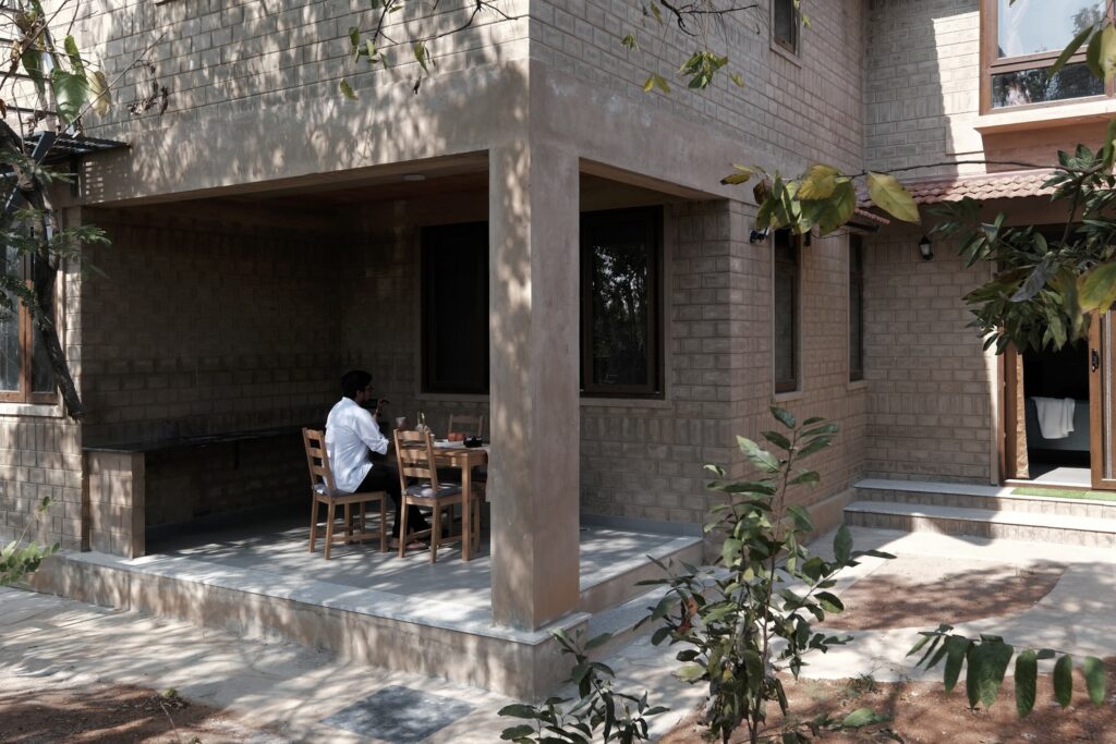 Exterior. Boulder House, Shoolagiri, Tamil Nadu, by HabitArt Architecture. Photographs by GeoMorph Studio