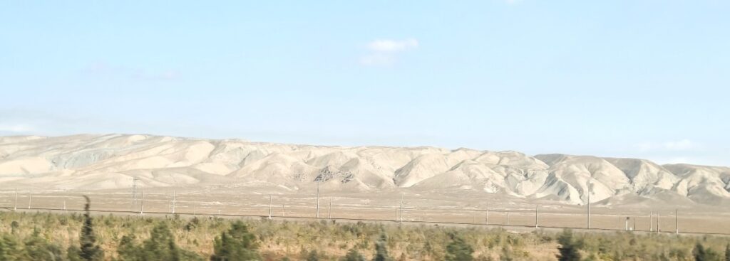 The arid low foothills of the Caucasus mountains around oil wells near Baku. © Suneet Paul